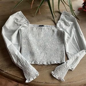 Lucy Paris checkered grey/teal top.